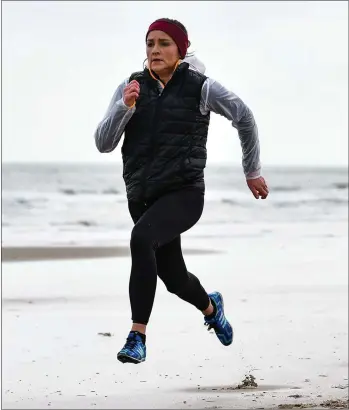  ??  ?? Internatio­nal athlete Phil Healy training on the beach close to her temporary Curracloe base last week.