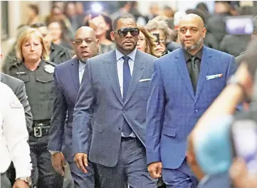  ??  ?? Grammy-winning R&amp;B singer R. Kelly arrives for a child support hearing at a Cook County courthouse in Chicago, Illinois, US Mar 6. — Reuters photo