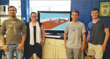  ?? URI photo by Neil Nachbar ?? The RI Votes Research Team is pictured from left: Ahmad Siddiqi, Assistant Professor Gretchen Macht, Nick Bernardo and James Houghton. Below: A 3D mock-up of a polling precinct was created by the research team.