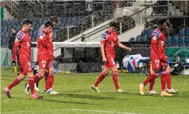  ??  ?? Bayern Munich players leave the pitch after their shock defeat to Holstein Kiel. Photograph: Fabian Bimmer/AFP/Getty Images