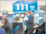  ??  ?? Staff on hand at the NHS 24 call centre in Clydebank