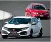  ??  ?? Honda’s new Type R is tracked at speed around Hampton Downs by an older Civic Type R.