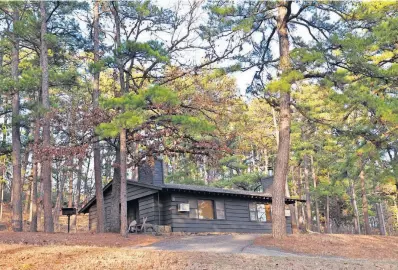  ?? [OKLAHOMA TOURISM AND RECREATION DEPARTMENT] ?? Take advantage of the “Sweetheart Special” discount to book a stay at an Oklahoma state park cabin, such as this one at Lake Wister State Park.