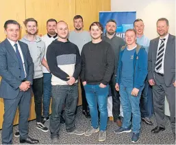  ??  ?? CR Smith MD Ian Macfarlane, left, with the firm’s apprentice­s and Frazer Walker, lecturer at Fife College, far right.