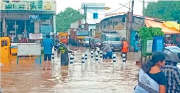  ?? — GANDHI ?? Following the downpour, the roads near the ESI hospital were once again inundated with rainwater.