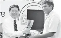  ??  ?? Sri Lanka Junior National Golf Champion Sachin de Silva receiving the trophy from chief guest Shun Tian Shing.
Pictures by Kithsiri de Mel