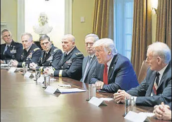  ?? AFP ?? US President Donald Trump, flanked by his defence secretary James Mattis (left) and Chief of Staff John Kelly (right), meets with senior military leaders in the White House on Thursday.