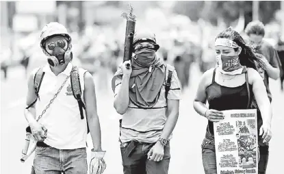  ?? OSWALDO RIVAS/REUTERS ?? Estudiante­s repudian las acciones de violencia del gobierno de Daniel Ortega.