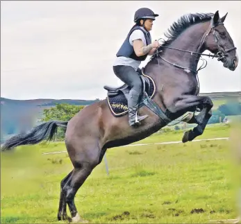  ?? Photos: Nick Miloutou and Marbeth Nix of PhotoGNick Arran. ?? Champion at 90cm, Isla Yuill and Velvet.