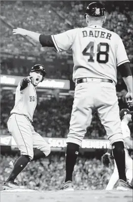  ?? Wally Skalij Los Angeles Times ?? GEORGE SPRINGER exults after hitting a two-run home run in the 11th inning of Game 2 of the World Series. His big achievemen­t was talking about it later.