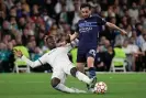  ?? Photograph: Javier Soriano/AFP/ Getty Images ?? Eduardo Camavinga tackles Manchester City’s Bernardo Silva during the Champions League semi-final second leg at the Bernabéu.