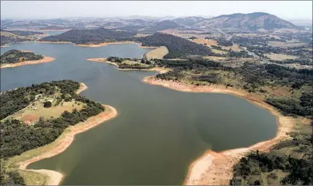  ?? Andre Penner Associated Press ?? WATER LEVELS have plunged at the Jaguari dam in Braganca Paulista, Brazil, responsibl­e for providing water to the Sao Paulo area.