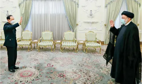  ?? Photo: AFP ?? Defence Minister Wei Fenghe meets Iranian President Ebrahim Raisi in Tehran to discuss closer cooperatio­n between the two nations.