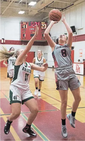  ?? BOB TYMCZYSZYN TORSTAR ?? Jean Vanier's Andrea Hebert, shown going up for a basket against Holy Cross in this file photo, is point guard for the host team at the Ontario high school girls A championsh­ips that wrap up Saturday in Welland.