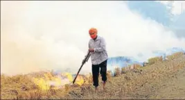  ??  ?? A green tribunal bench, headed by NGT chairperso­n justice Adarsh Kumar Goel, said there is a need to find out a longlastin­g solution to the problems of stubble burning. HT FILE