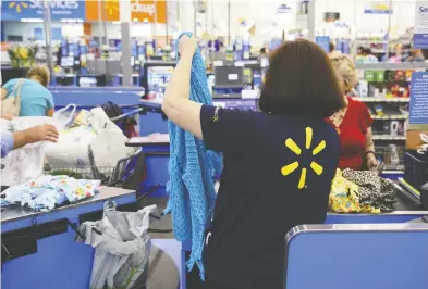  ?? PATRICK T. FALLON / BLOOMBERG FILES ?? Walmart’s second-quarter results, along with economic data released Thursday that showed stronger-than-expected
American retail sales in July, helped calm analysts’ fears that the country is headed into recession.