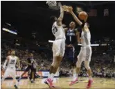  ?? TOM LYNN — ASSOCIATED PRESS ?? Villanova’s Jalen Brunson goes in for a layup past Marquette’s Jamal Cain, left, and Marquette’s Matt Heldt during the second half Jan. 28.