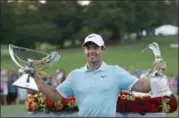  ?? JOHN BAZEMORE — THE ASSOCIATED PRESS FILE ?? In this Sept. 25, 2016photo, Rory McIlroy poses with the trophies after winning the Tour Championsh­ip golf tournament and the FedEX Cup at East Lake Golf Club, in Atlanta. Along with revamping the PGA Tour schedule in two years, this would be a great...