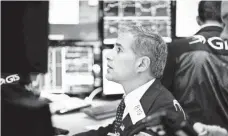  ?? JUSTIN LANE, EPA-EFE ?? Traders on the floor of the New York Stock Exchange have seen record-breaking highs all week.