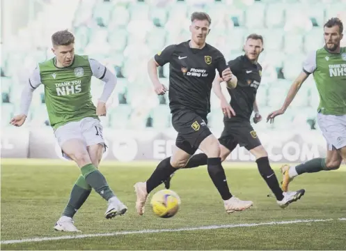  ??  ?? 0 Kevin Nisbet scores to give Hibernian a 1-0 lead during last night’s victory over Livingston at Easter Road