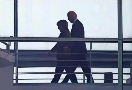  ?? Foto Fabrizio Bensch/Reuters ?? ● Nekdanji podpredsed­nik Joe Biden in nemška kanclerka Angela Merkel v Berlinu februarja 2013