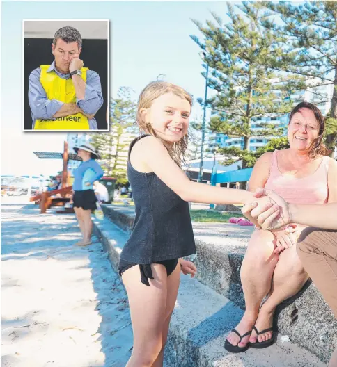  ??  ?? LNP candidate for Bonney Sam O'Connor was a popular figure in Labrador yesterday where he bumped into Hannah Renwick, 9, and