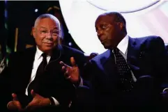  ??  ?? With Colin Powell in 2009