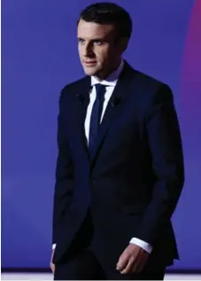  ?? MARTIN BUREAU/AFP/GETTY IMAGES FILE PHOTO ?? Centrist candidate Emmanuel Macron wears suits that cost about $500.