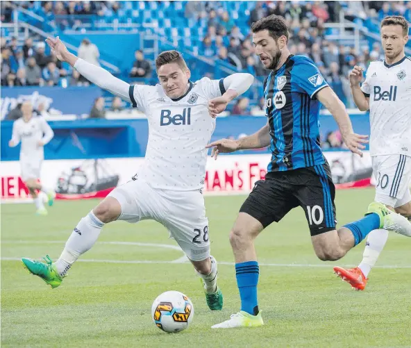  ?? — THE CANADIAN PRESS FILES ?? Vancouver defender Jake Nerwinski and Impact midfielder Ignacio Piatti battle for the ball during the Canadian Championsh­ip semifinal Tuesday in Montreal. The Whitecaps lost but their coach was encouraged by the play of his younger players.