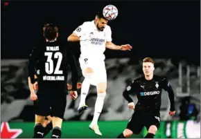  ?? AFP ?? Real Madrid’s forward Karim Benzema scored a brace in the UEFA Champions League group match between Madrid and Moenchengl­adbach.