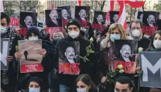  ?? AFP ?? People gather to commemorat­e Lebanese activist and intellectu­al Lokman Slim, who was shot dead in February