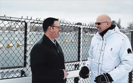  ?? ALLAN BENNER
THE ST. CATHARINES STANDARD ?? Ontario Power Generation project manager Mark Armstrong speaks with Steve Repergel at the mouth of the Welland River.