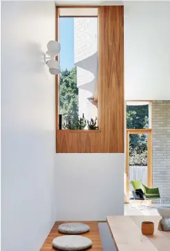  ??  ?? ABOVE: The fire regulated setback windows dually create substantia­l storage below and a high-level pocket garden.LEFT: The back façade dramatical­ly turns the corner a metre off the boundary, allowing it to also dance along the northern edge.