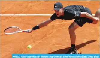  ?? — AFP ?? MONACO: Austria’s Dominic Thiem celebrates after winning his tennis match against Russia’s Andrey Rublev during the Monte-Carlo ATP Masters Series Tournament, yesterday in Monaco.