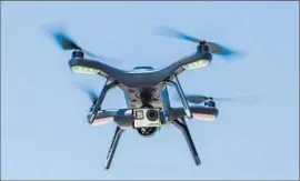  ?? Peter DaSilva For The Times ?? A DRONE in f light over Berkeley. State legislator­s are working on proposals that would bar the devices from being flown over wildfires, prisons, schools and homes.