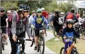  ??  ?? Skylar Barti/The Signal Parents and Kids set off on the 4-mile ride for the Hit the Trail Bike Ride this past weekend.