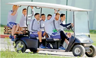  ?? AP ?? Argentina’s Angel Di Maria drives teammates to a training session on Friday, eve of their match against Iceland.
The Group ‘D’ match pits an Argentine side that critics say is too focused on superstar Lionel Messi against a band of grafters from...