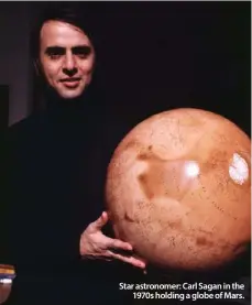  ??  ?? Star astronomer: Carl Sagan in the
1970s holding a globe of Mars.