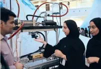  ?? Photo by Juidin Bernarrd ?? rawdha Al Hammadi and ohoud Alyammahi explain their project, that aims to produce fresh water by use of mechanical energy produced by natural sources of energy.—