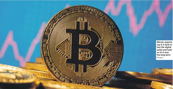  ?? Reuters ?? Bitcoin experts say it is best to buy the digital asset and hold on to it over the long term