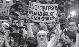  ??  ?? Citizens hold placards in New Delhi during a protest against lynching on Wednesday.