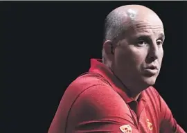  ?? Marcio Jose Sanchez Associated Press ?? USC’S CLAY HELTON, who has changed the way he deals with players, participat­es in the Pac-12 Conference media day at the Hollywood & Highland Center.