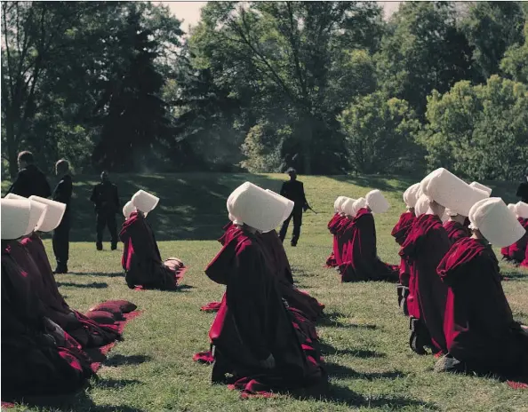  ?? TAKE FIVE/HULU ?? The society in The Handmaid’s Tale, a new 10-part series based on Margaret Atwood’s novel, is rigidly stratified by class and function.