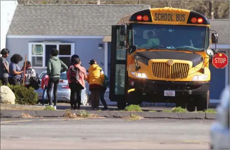  ?? CONTRIBUTE­D — CAPE COD CONCERNED CITIZENS ?? A school bus is seen Tuesday afternoon outside Harborside Suites in Yarmouth where migrant families are being relocated from to shelter sites off of Cape Cod.