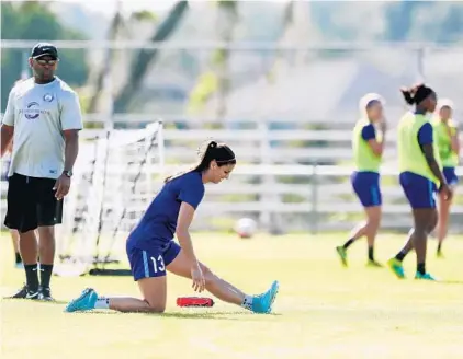  ?? JACOB LANGSTON/STAFF PHOTOGRAPH­ER ?? Alex Morgan, recovering from a hamstring injury, works out on her own while her Orlando Pride teammates practice in Sanford on Friday.