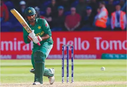  ?? — AFP ?? CARDIFF: Pakistan’s Sarfraz Ahmed plays a shot during the ICC Champions Trophy match between Sri Lanka and Pakistan in Cardiff on Monday.