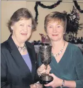  ??  ?? Lady Captain Maria Walshe presents the Golfer of the Year to Catherine Lord.