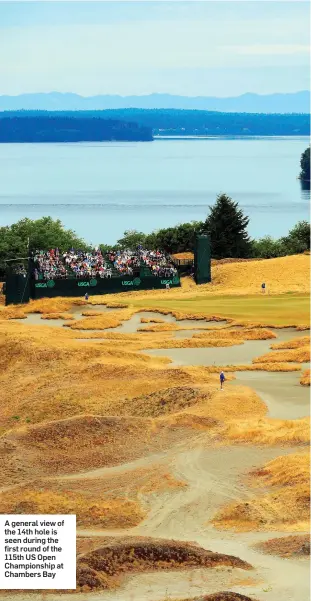  ??  ?? A general view of the 14th hole is seen during the first round of the 115th US Open Championsh­ip at Chambers Bay
