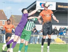  ?? ?? Sports’ skipper Mark Jones (orange) beats the Blyth Spartans’ goalkeeper to the ball.