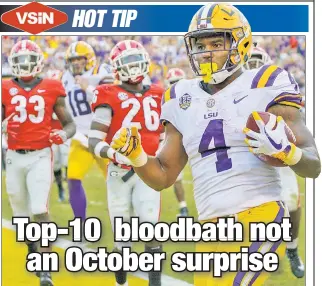  ?? AP ?? DOG DAZE: No. 2 Georgia, which lost to LSU and running back Nick Brossette (above), was one of four top-10 teams to go down last weekend.